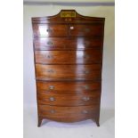 A George III mahogany bowfronted chest on chest, with cockbeaded drawers and later brass plate