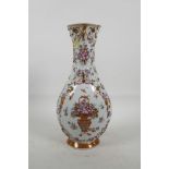 A C19th Chinese export famille rose porcelain baluster vase, with raised decoration and hand