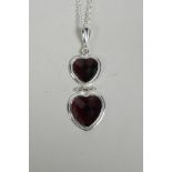 A 925 silver and amethyst double heart drop pendant, 1½" drop