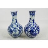 A pair of Chinese blue and white porcelain vases with bulbous bodies and long necks, seal mark to