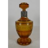 A Bohemian flash cut amber glass decanter, with banded decoration, German sterling silver collar