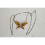 A silver and amber butterfly pendant on a fine silver double link chain