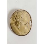 A gilt framed composition cameo brooch of Diana the huntress, A/F, 2" long