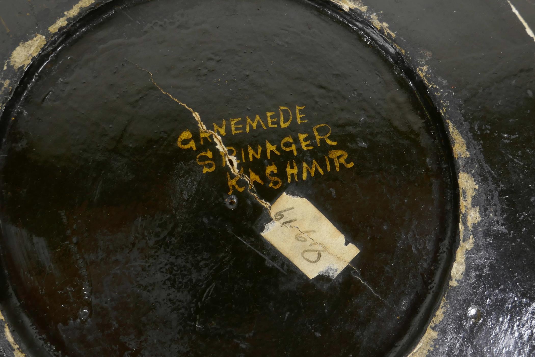 A Kashmiri brass and lacquer bowl with a rolled rim, decorated with gilt floral patterns, signed - Image 7 of 7