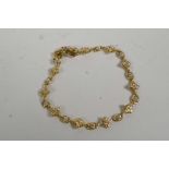 A 925 silver gilt bracelet with flower shaped links, 7" long