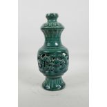 A Chinese green crackle glazed porcelain vase with reticulated dragon decoration to the body, mark