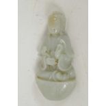 A Chinese carved celadon jade figure of a seated deity