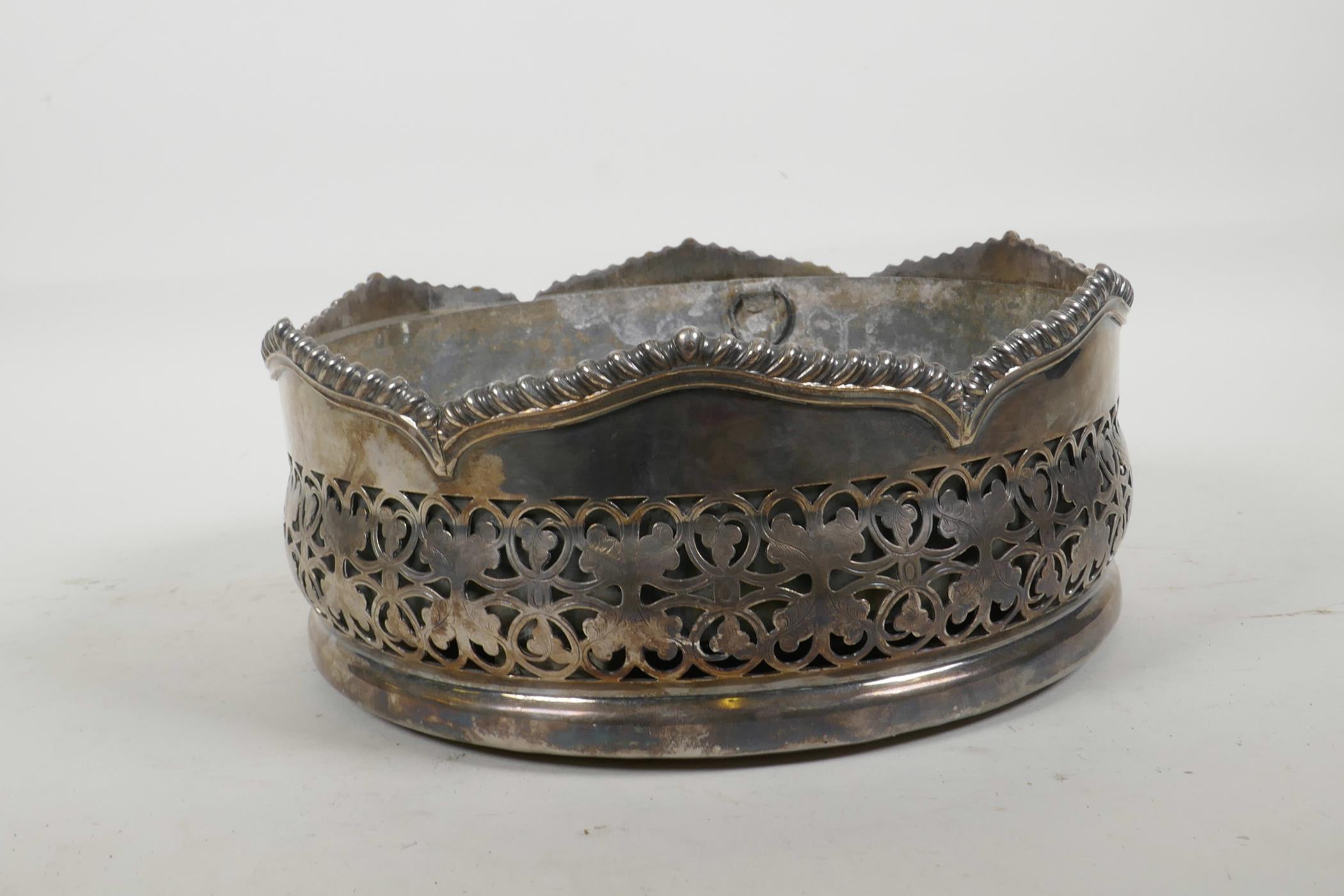 A silver plated table centrepiece coaster, with pierced foliate decoration and gadrooned rim, and - Image 2 of 3