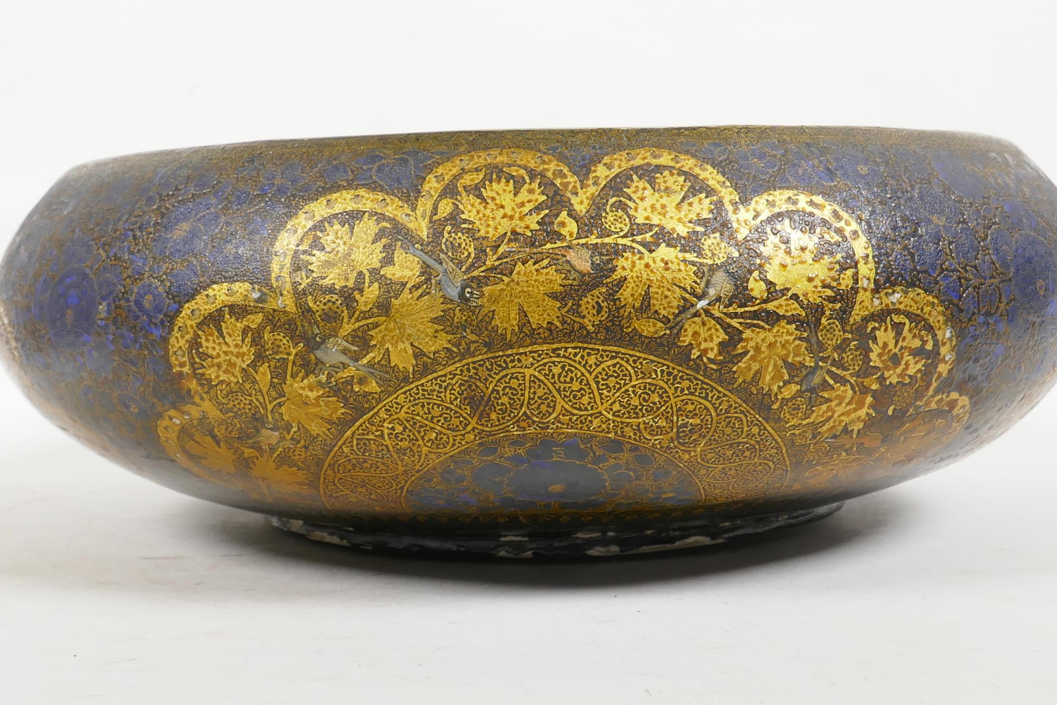 A Kashmiri brass and lacquer bowl with a rolled rim, decorated with gilt floral patterns, signed - Image 2 of 7