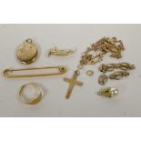 A mixed lot of marked 9ct gold, comprising a locket, a crucifix, a fine necklace, a cut 18ct gold