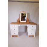 A painted pine six drawer kneehole dressing table with removable mirrored top, 56" x 21" x 31"