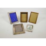 Two sterling silver photo frames, both hallmarked, A/F, 7" x 5", together with a small silver frame,