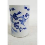 A Chinese blue and white porcelain brush pot decorated with bird and a flowering tree, 6 character