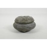 A Chinese bronze censer and cover on tripod supports, impressed mark to base, 5½" diameter