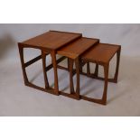 A nest of three quadrille teak tables designed by R. Bennett for G-Plan, 21" x 17", 19" high