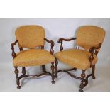 A set of six Georgian style mahogany scroll armchairs with turned supports and shaped stretchers,