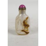 A Chinese carved agate snuff bottle with bird decoration, 3" high