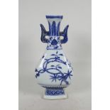 A Chinese blue and white porcelain sectional vase with two lug handles and trailing branch