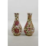 A pair of early C20th Fischer J. Budapest vases, enamelled with floral and foliate decoration,