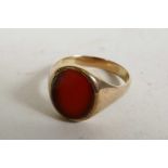 A carnelian man's signet ring in 9ct gold, unmarked but tested, approximate size 'U', 4.9g