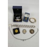 A small collection of unmarked silver and other costume jewellery including a silver bangle