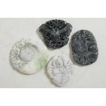 Four Chinese carved hardstone pendants, 2" diameter