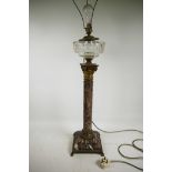 An impressive C19th red Griotte marble column lamp, with an ormolu capital and base featuring