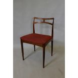 A mid century Danish hardwood side chair designed by Johannes Andersen, 30½" high