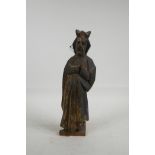 An antique carved wood figure of a bishop, 12" high