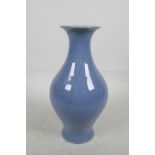 A Chinese porcelain blue glazed vase with crackle glaze decoration, 9½" high