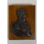A bronze profile plaque of Wellington, mounted on an oak base, 9" x 7"