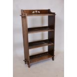 An Edwardian oak open bookcase with peg joined shelves, 25" x 40" x 8"