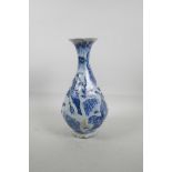 A Chinese blue and white pottery octagonal pear shaped vase decorated with warriors hunting a tiger,