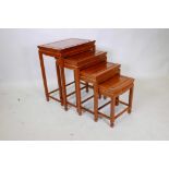 A nest of four oriental hardwood occasional tables, with moulded panel tops, 20" x 14" x 26"