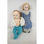 A Pedigree plastic doll with sleeping eyes, open mouth with two teeth and moulded hair, 13" long,