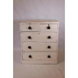 An early C19th painted pine chest of two over three drawers, 31" x 19" x 37"