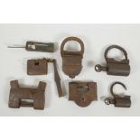 Seven oriental iron padlocks, largest 5" long