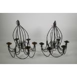 A pair of wrought iron six light chandeliers, 13½" diameter, A/F