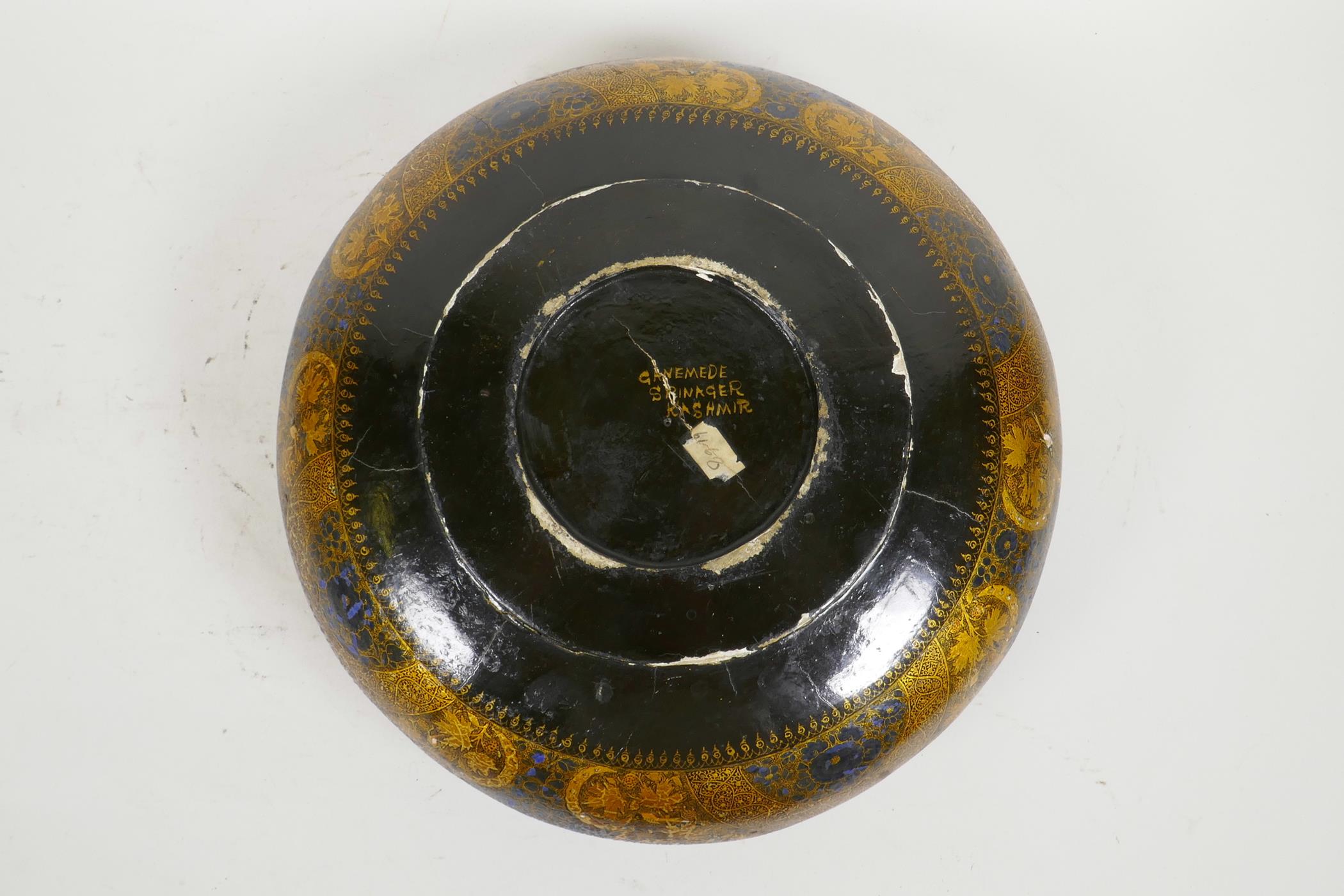 A Kashmiri brass and lacquer bowl with a rolled rim, decorated with gilt floral patterns, signed - Image 6 of 7