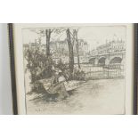 City river scene with lady seated on park bench and large building on the far bank, etching,