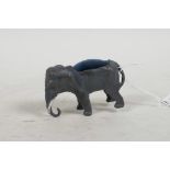 A cold painted bronze elephant pin cushion