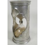 A French pewter one hour sand timer engraved with the sun and moon, and marked 'Etain', 6½" high