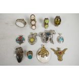 An assorted collection of twelve Indian stone and shell set white metal rings and pendants