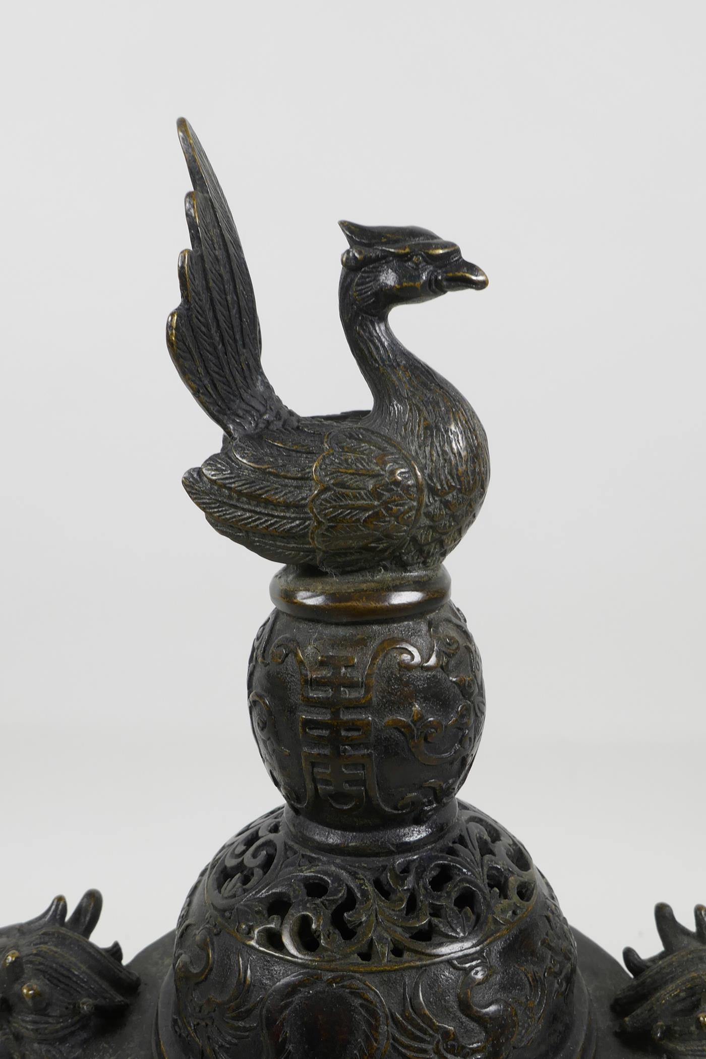 A Chinese bronze censer and cover with two dragon head handles and phoenix decoration to the - Image 2 of 5