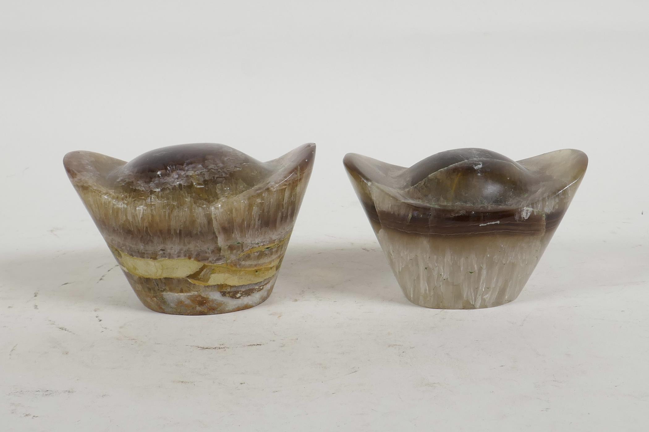 A pair of Chinese carved fluorspar weights, 3½" wide