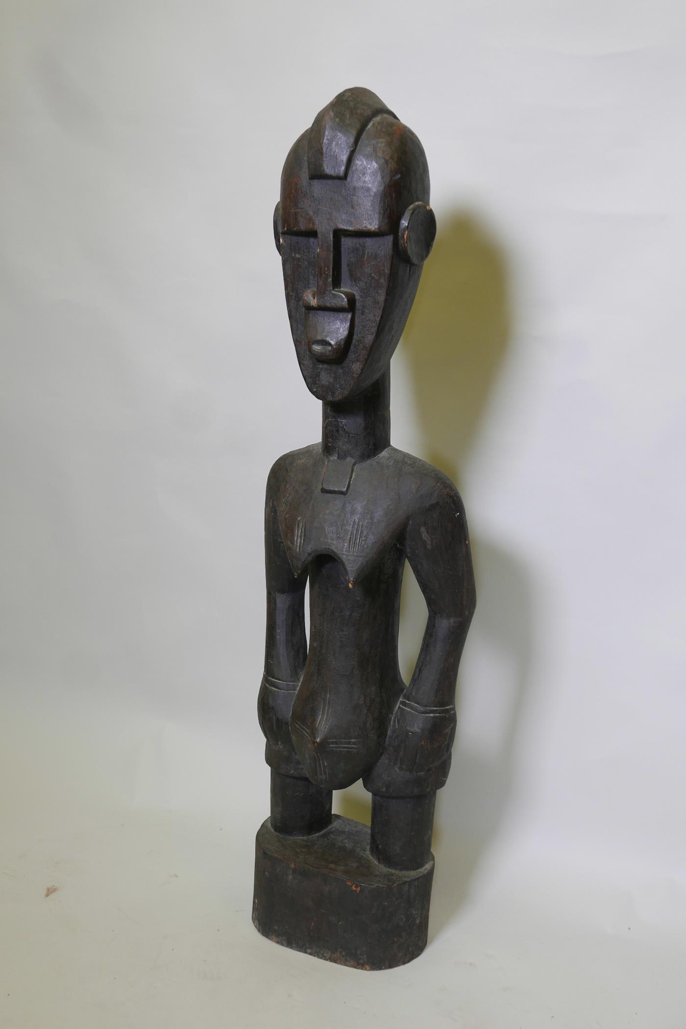 An African carved wood ethnic fertility figure of a woman, 39" high - Image 2 of 2