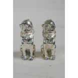 A pair of white metal condiments in the form of dogs, stamped 800 to the base, 2½"