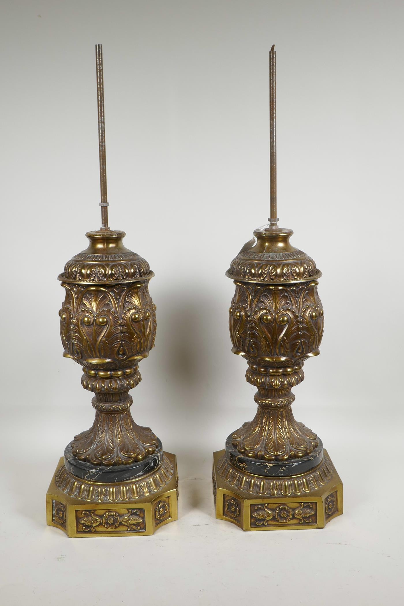 A pair of ornate urn shaped gilt spelter lamp bases, 17" high to top of urn