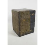 A set of stacking Japanese lacquer boxes, decorated in black and gold lacquerwork with gilded