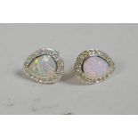 A pair of silver, cubic zirconium and opalite set pear shaped earrings